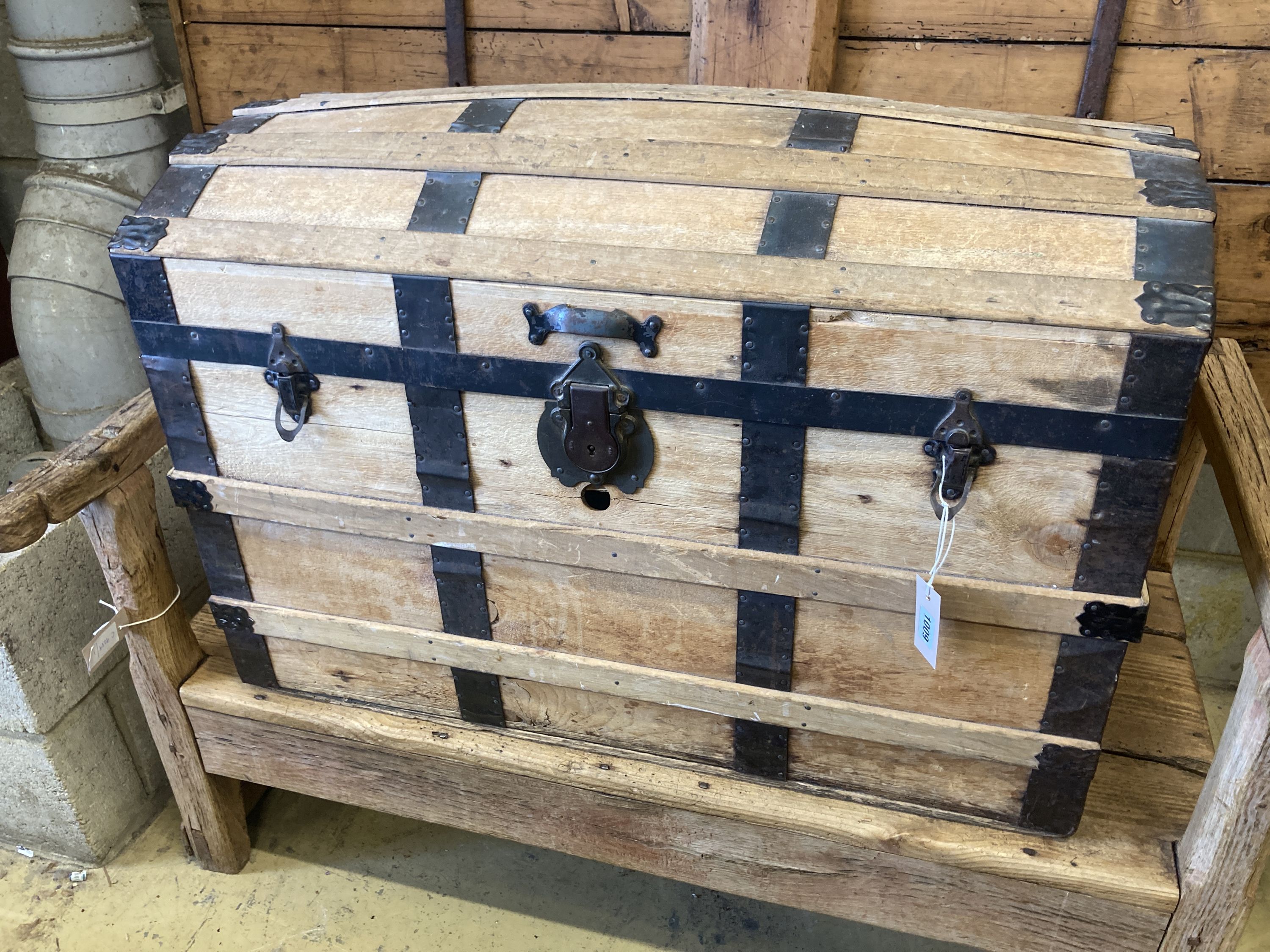 An early 20th century iron bound dome topped travelling trunk, width 87cm, depth 49cm, height 57cm